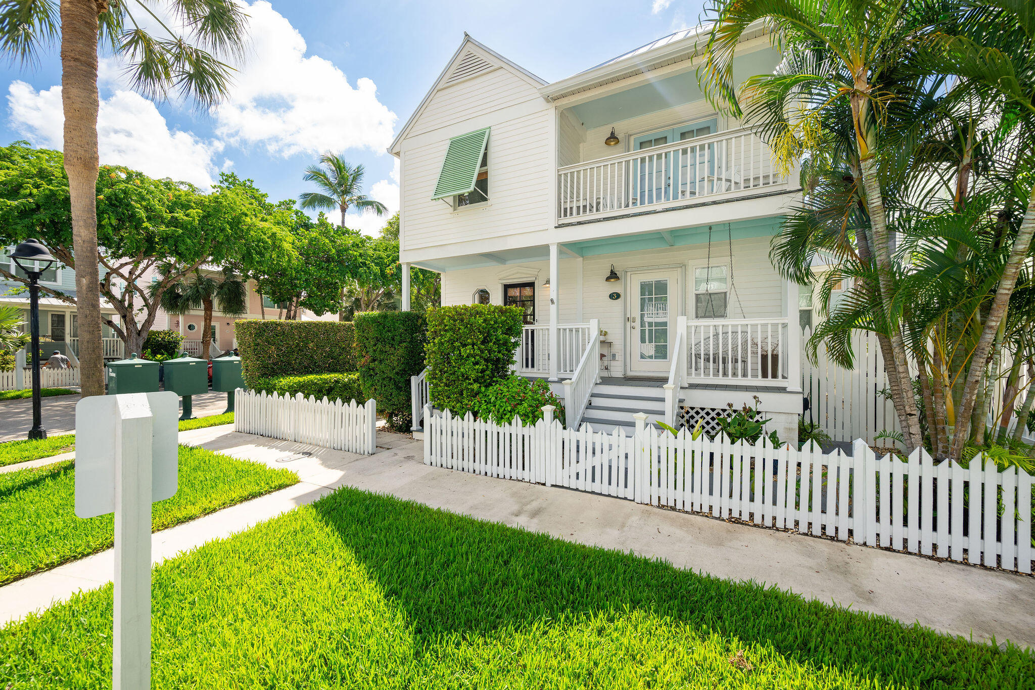 1 Spoonbill Way Key West, FL 33040 - Photo 2 of 38 a front view of a house with a yard table and chairs