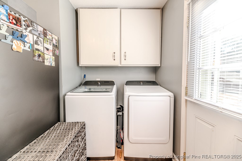 476 Riddle Road Sanford, NC 27330 - Photo 11 of 34 a utility room with dryer and washer
