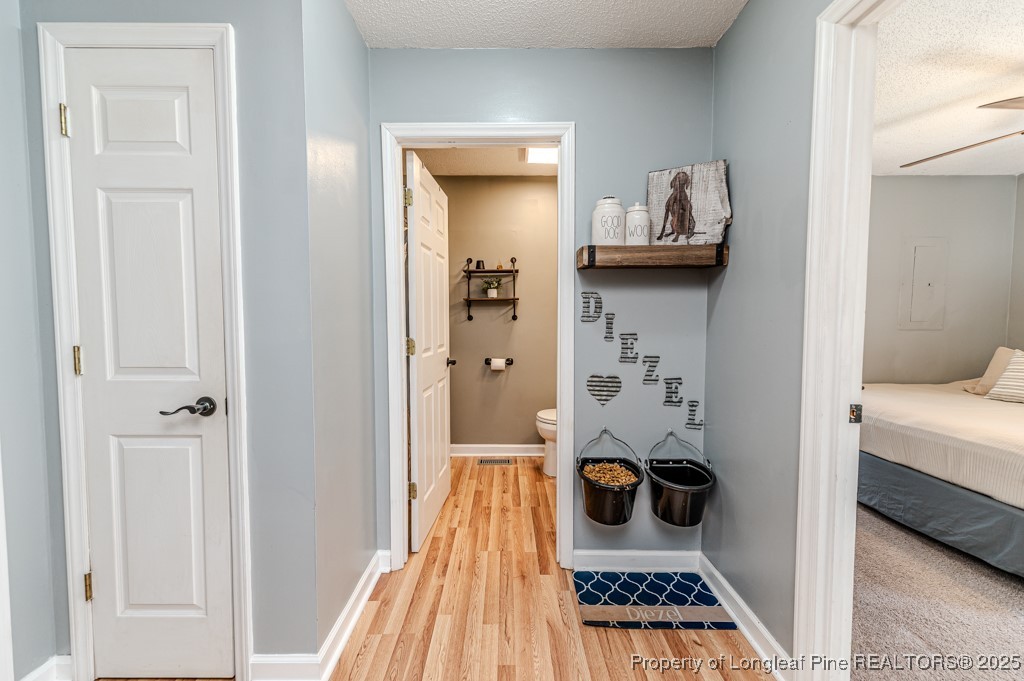 476 Riddle Road Sanford, NC 27330 - Photo 12 of 34 a view of a hallway with room and wooden floor