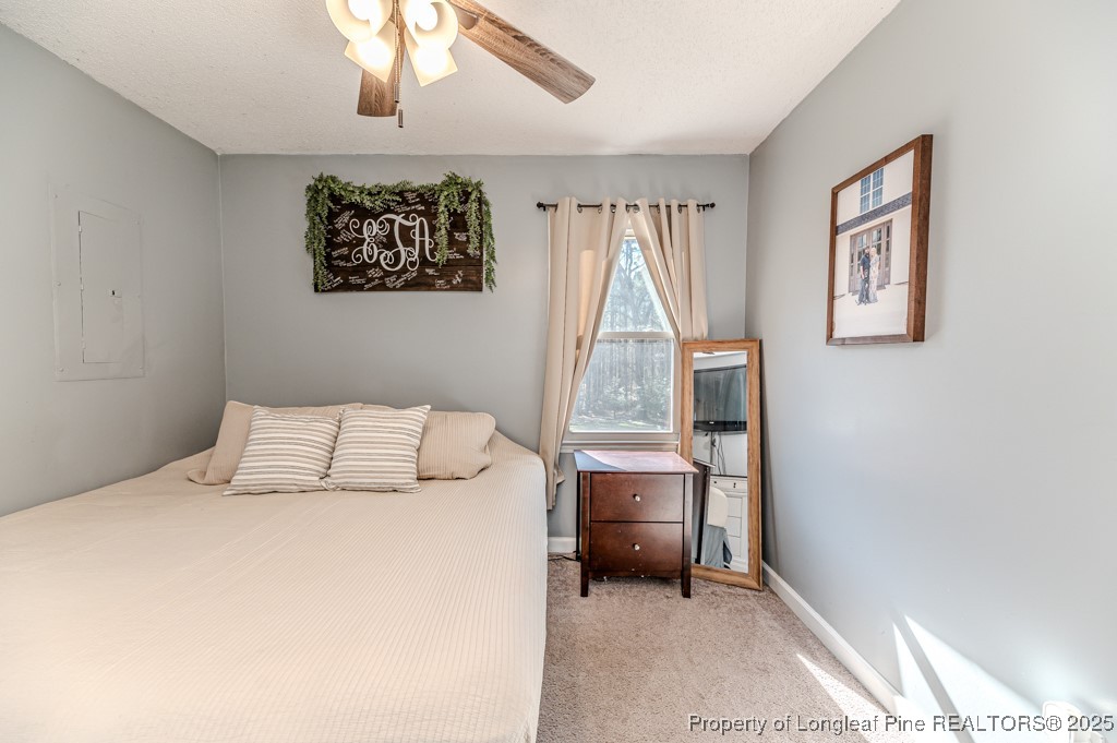 476 Riddle Road Sanford, NC 27330 - Photo 14 of 34 a bedroom with a bed and a window