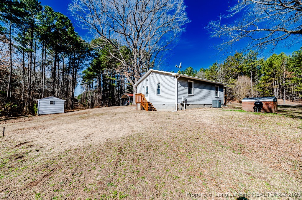 476 Riddle Road Sanford, NC 27330 - Photo 20 of 34 a view of a house with snow on the road