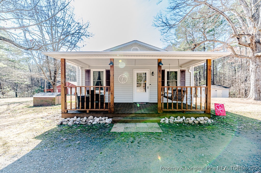 476 Riddle Road Sanford, NC 27330 - Photo 2 of 34 front view of a house with a yard
