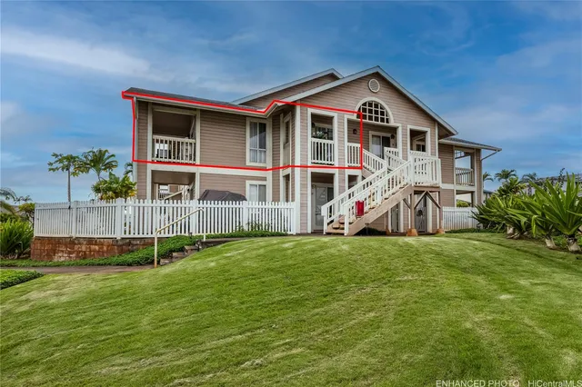 a view of a house with a yard and sitting area