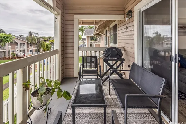 a view of a balcony with chairs