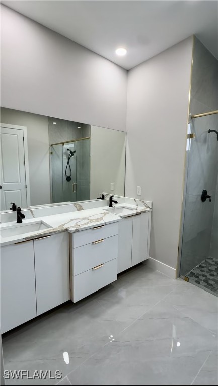 113 Connecticut Road Lehigh Acres, FL 33936 - Photo 3 of 6 a bathroom with double vanity two mirror and a bathtub