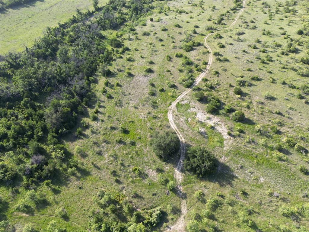 2486 & Cr Hamilton, TX 76531 - Photo 28 of 31 a view of a bathroom with a small window
