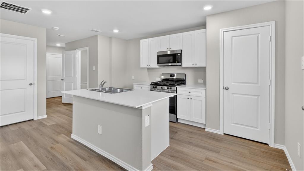 5532 Corduroy Road Krum, TX 76249 - Photo 14 of 16 Kitchen- All Home and community information, including pricing, included features, terms, availability and amenities, are subject to change at any time without notice or obligation. All Drawings, pictures, photographs, video, square footages, floor plans, elevations, features, colors and sizes are approximate for illustration purposes only and will vary from the homes as built.