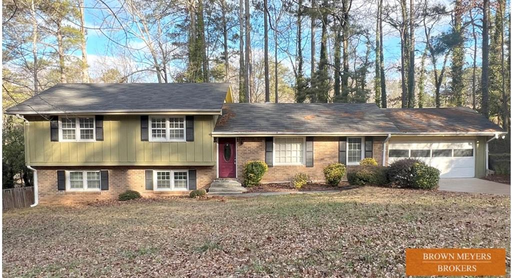 5295 Orange Drive Southwest Atlanta, GA 30331 - Photo 1 of 1 a front view of a house with garden