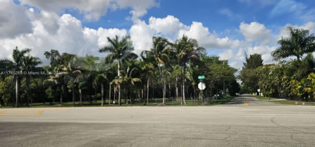 a view of a backyard with swimming pool