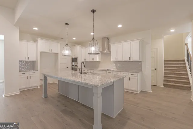 a bathroom with a double vanity sink and mirror