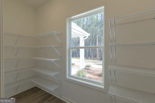 a bathroom with a toilet a sink a mirror a bathtub and vanity