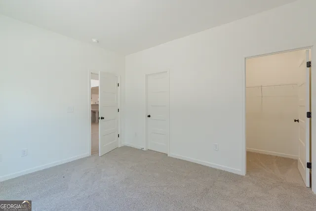 a bathroom with a toilet a sink a mirror a bathtub and vanity