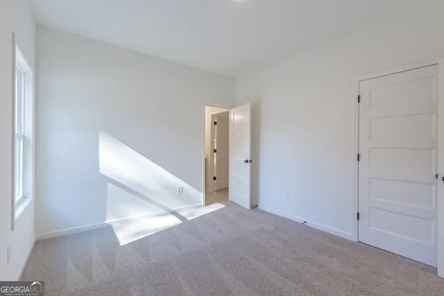 a front view of house with a garden