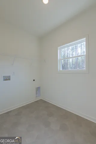 a backyard of a house with yard and outdoor seating