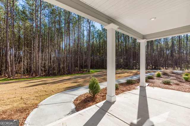 a view of a hallway with wooden shelves