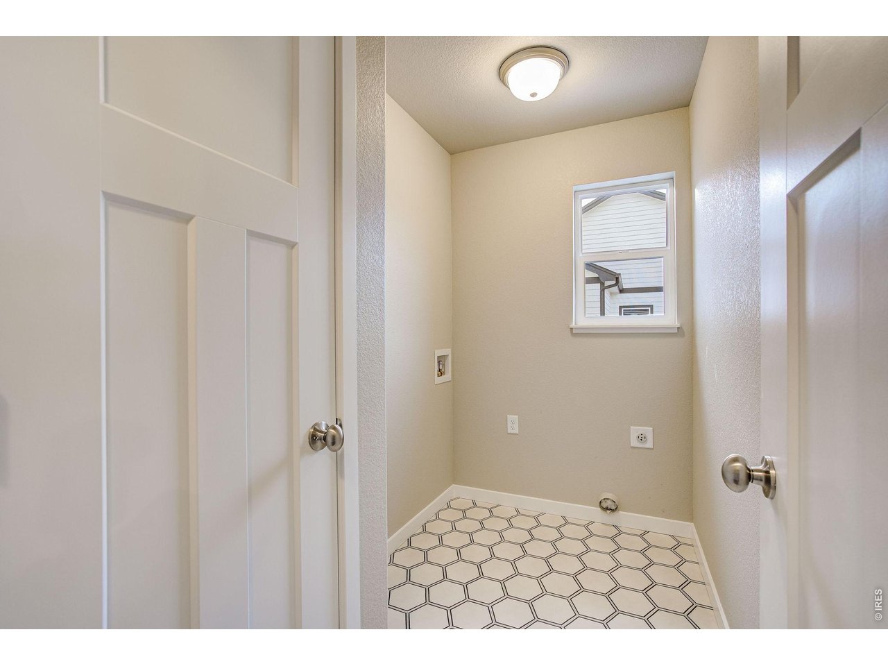 7040 Feather Reed Drive Wellington, CO 80549 - Photo 15 of 32 a bedroom with a bed and a table
