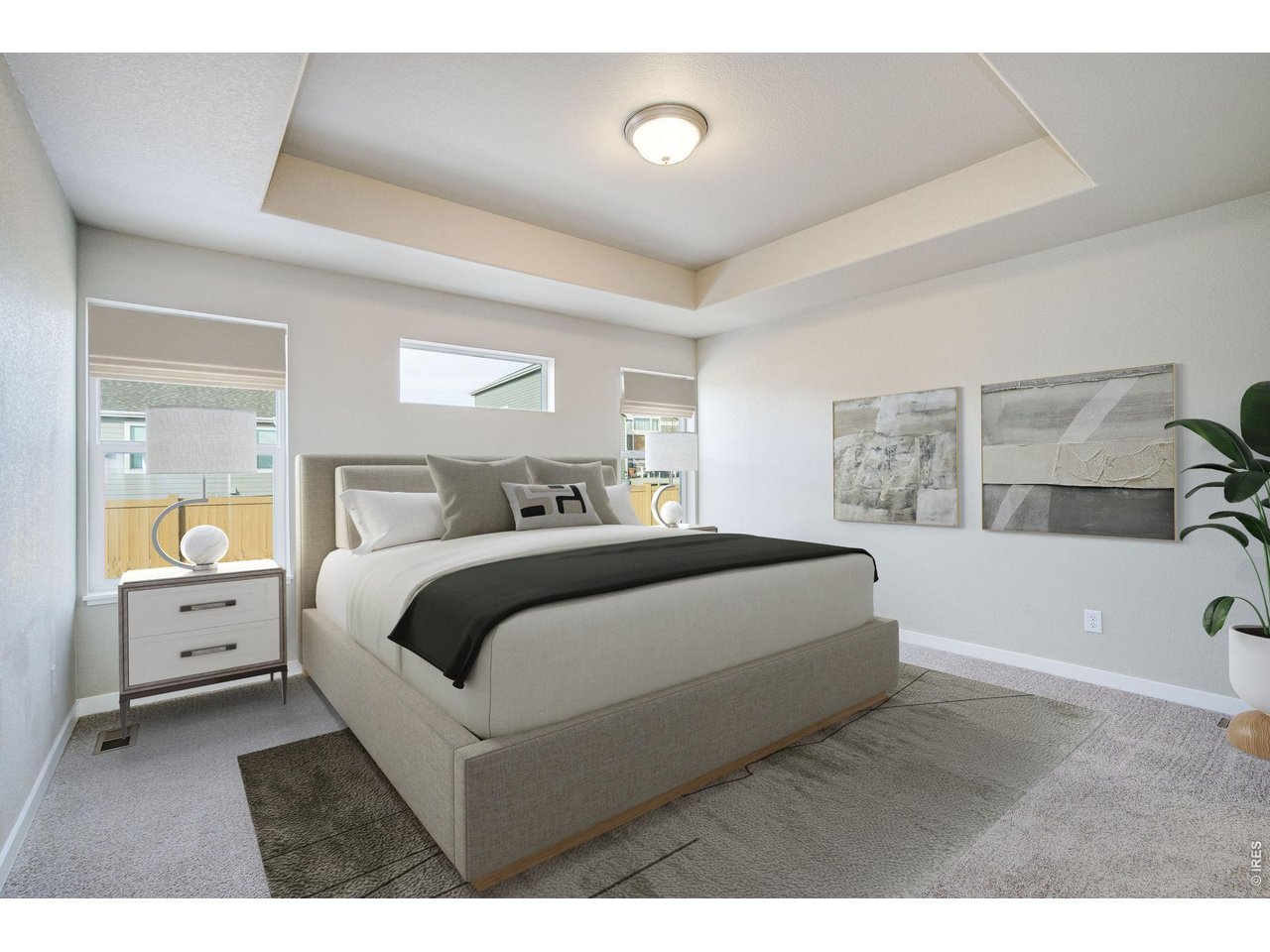 7040 Feather Reed Drive Wellington, CO 80549 - Photo 16 of 32 a bedroom with a large bed and a couch