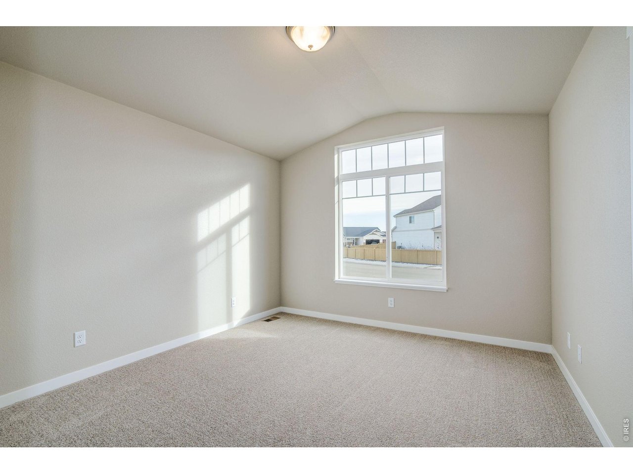 7040 Feather Reed Drive Wellington, CO 80549 - Photo 22 of 32 a view of an empty room with a window