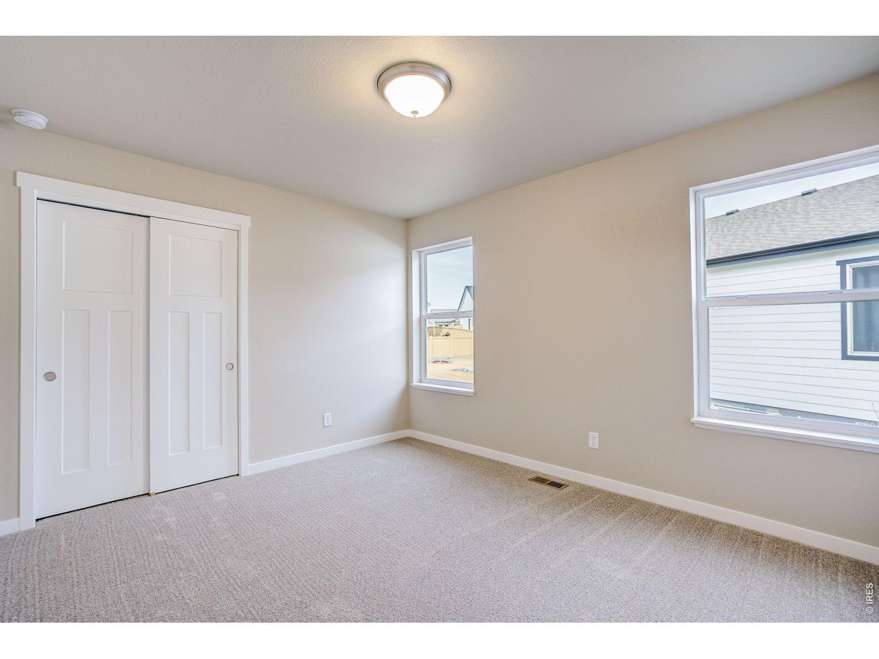 7040 Feather Reed Drive Wellington, CO 80549 - Photo 24 of 32 a view of an empty room with a window