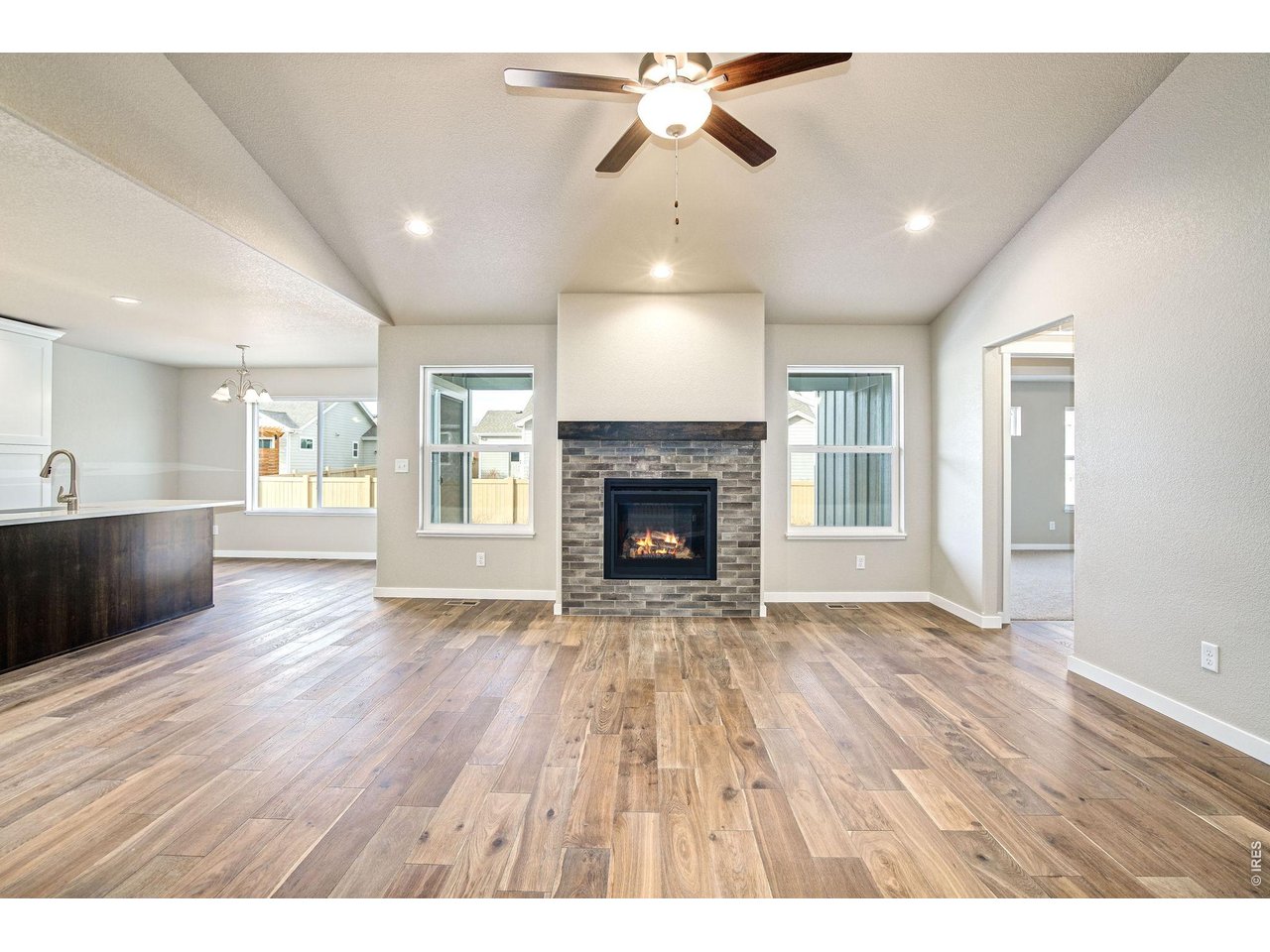 7040 Feather Reed Drive Wellington, CO 80549 - Photo 5 of 32 a view of an empty room with window and wooden floor