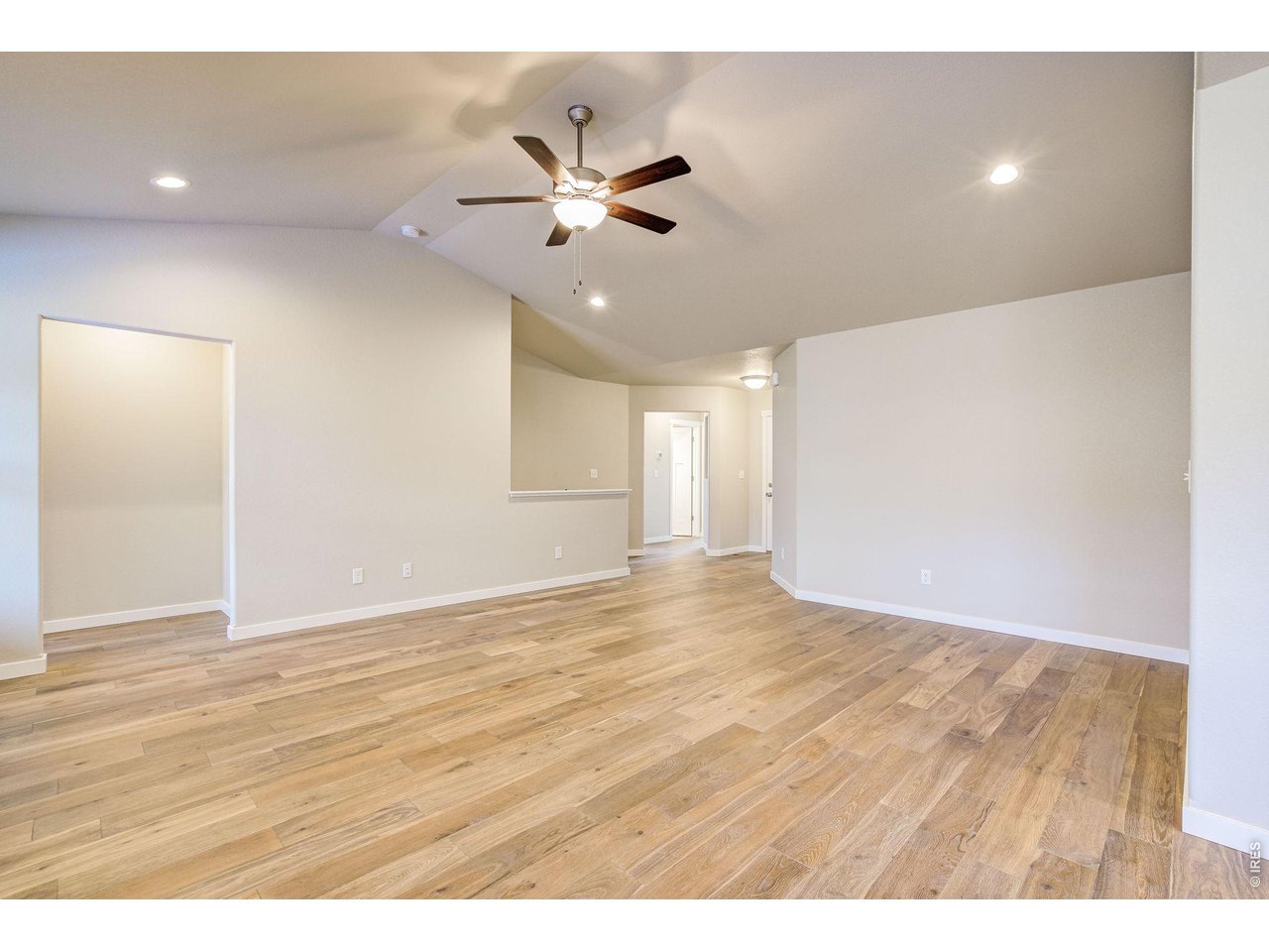 7040 Feather Reed Drive Wellington, CO 80549 - Photo 6 of 32 a view of an empty room with wooden floor