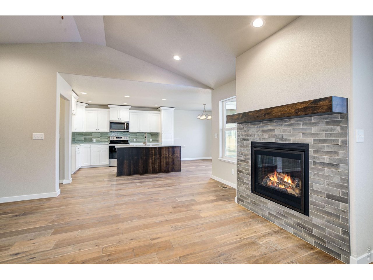 7040 Feather Reed Drive Wellington, CO 80549 - Photo 7 of 32 a living room with stainless steel appliances and a fireplace