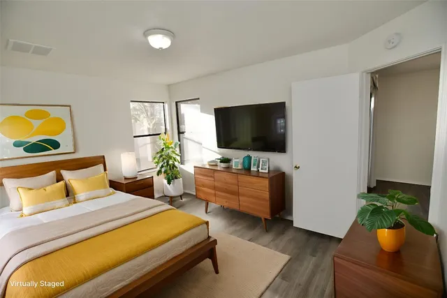 a bedroom with a bed and furniture