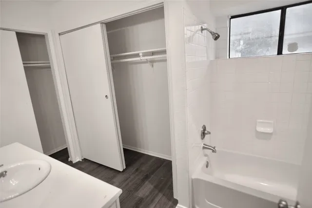 a bathroom with a bathtub and a shower