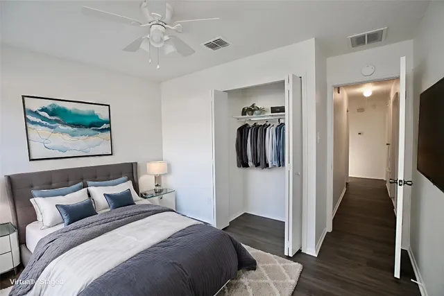 a bedroom with a bed and a view of bathroom
