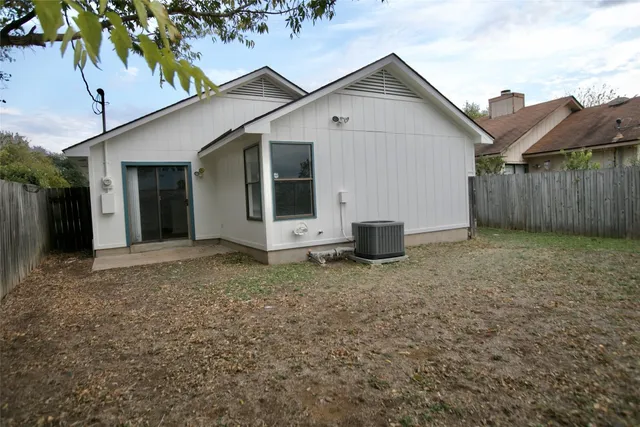 a view of a house with a yard and garage