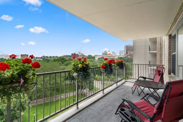 a view of a chairs and tables in the balcony