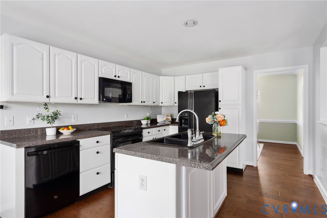 16379 Arch Hill Road Hanover, VA 23069 - Photo 9 of 26 a kitchen with stainless steel appliances granite countertop a sink stove and refrigerator