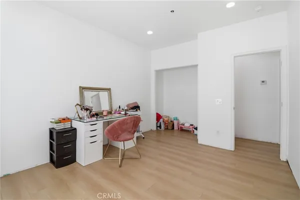 a workspace with furniture and wooden floor