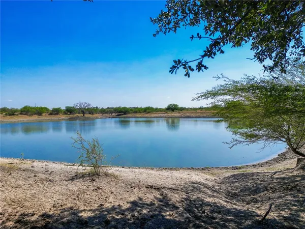 a view of a lake with a house