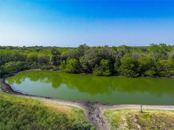 a view of a lake with a yard