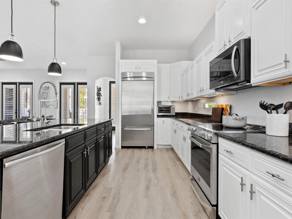 2159 Hawthorne Street Sarasota, FL 34239 - Photo 11 of 47 a large kitchen with stainless steel appliances granite countertop a stove a sink dishwasher and a refrigerator