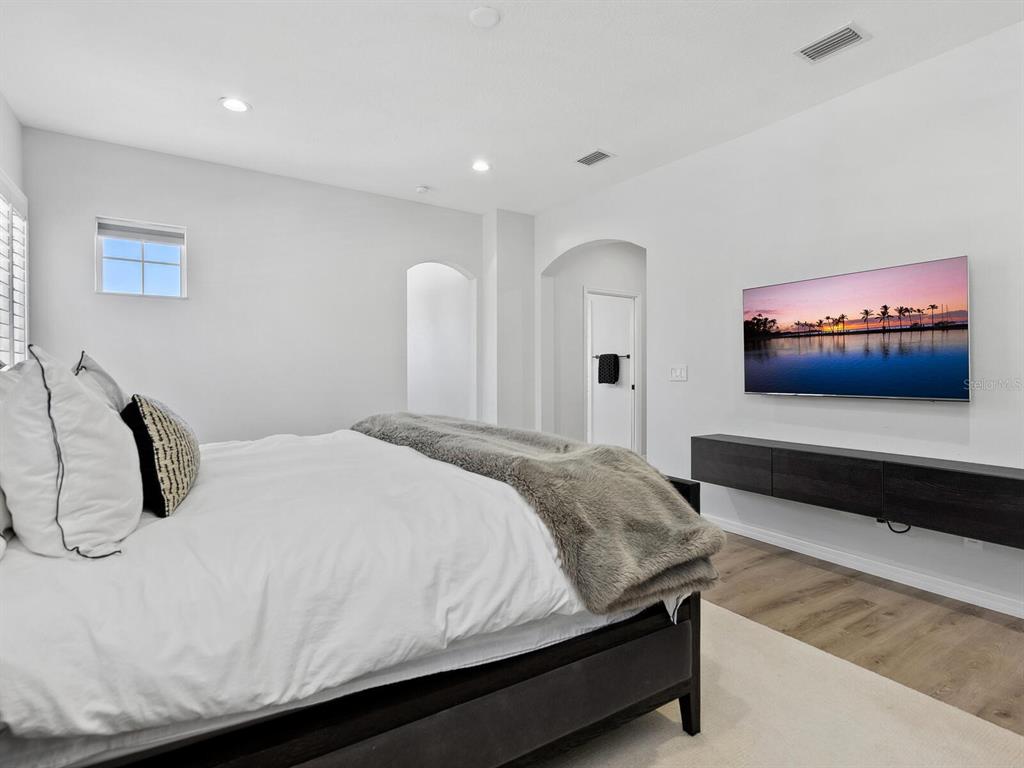 2159 Hawthorne Street Sarasota, FL 34239 - Photo 21 of 47 a bedroom with a bed and a couch