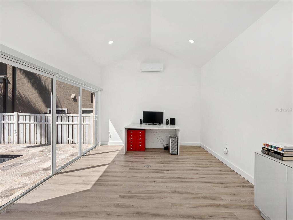2159 Hawthorne Street Sarasota, FL 34239 - Photo 28 of 47 a living room with furniture and a wooden floor