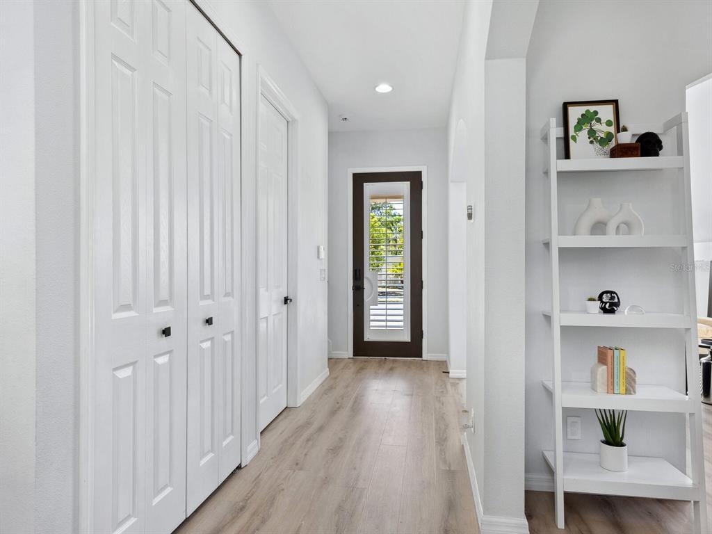 2159 Hawthorne Street Sarasota, FL 34239 - Photo 3 of 47 a view of a hallway with wooden floor and closet