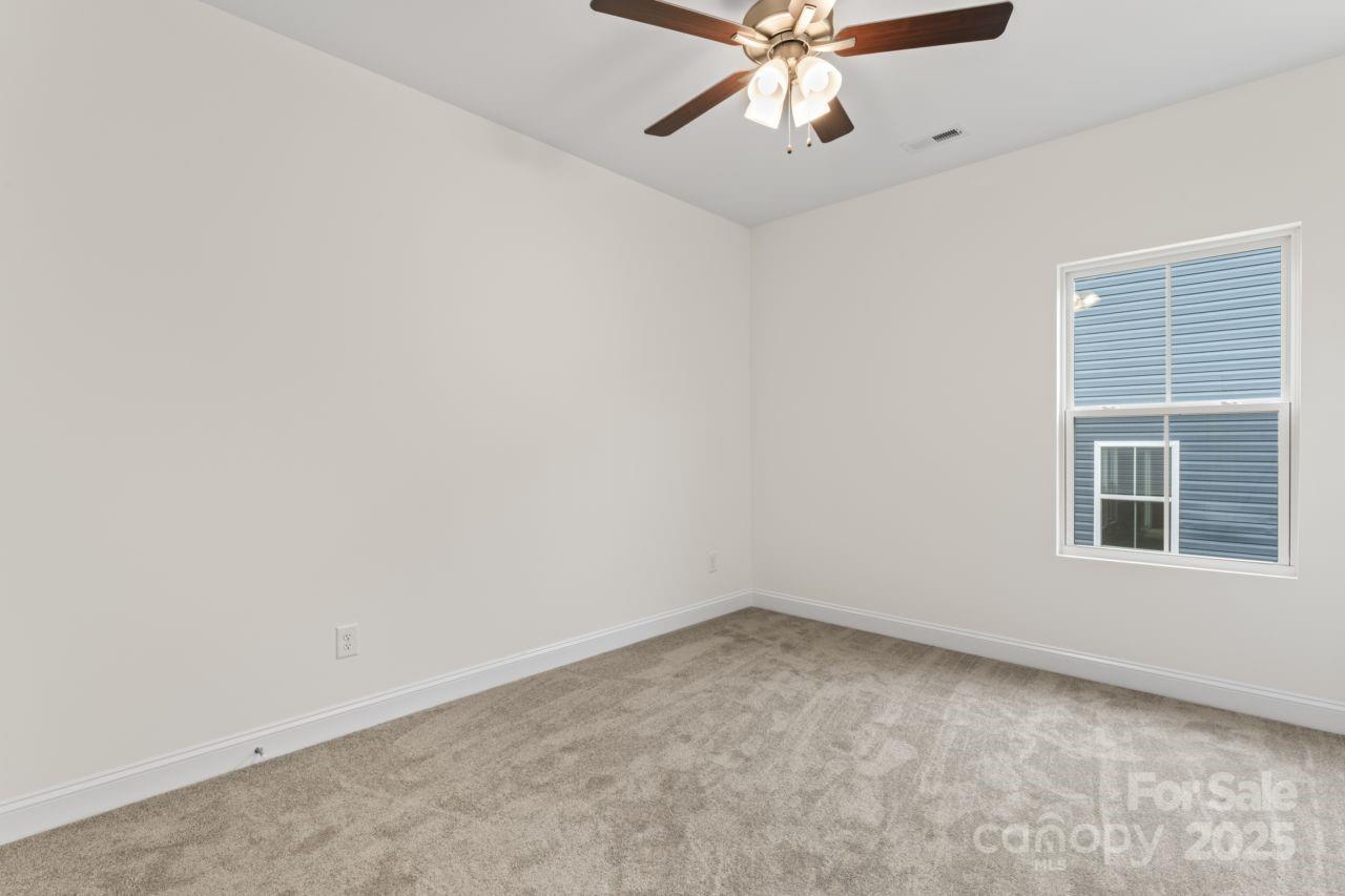 751 Mockingbird Road, Unit 1 Albemarle, NC 28001 - Photo 15 of 29 an empty room with a window and a fan