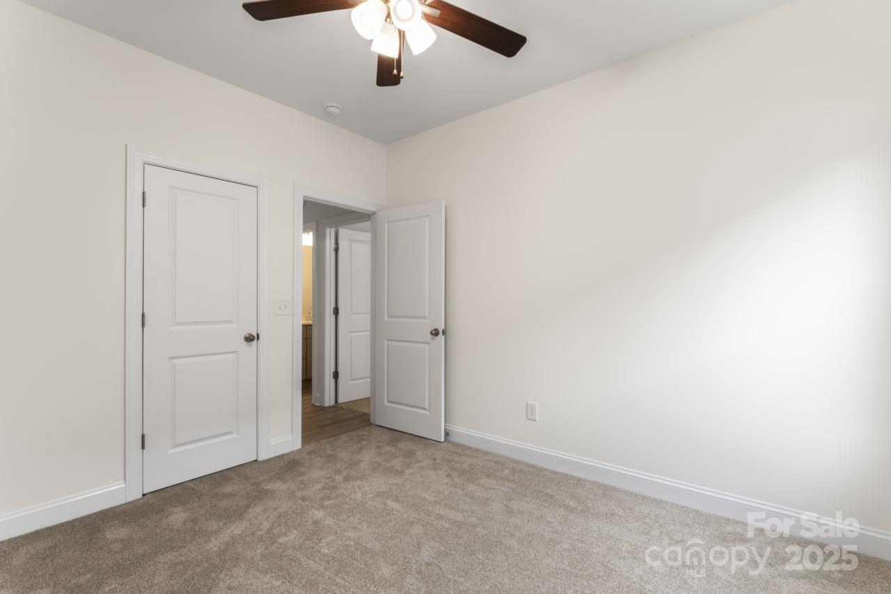 751 Mockingbird Road, Unit 1 Albemarle, NC 28001 - Photo 17 of 29 an empty room with chandelier fan