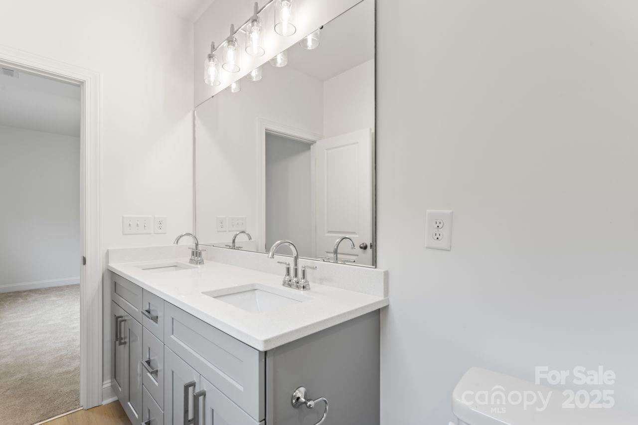 751 Mockingbird Road, Unit 1 Albemarle, NC 28001 - Photo 27 of 29 a bathroom with a sink and a mirror