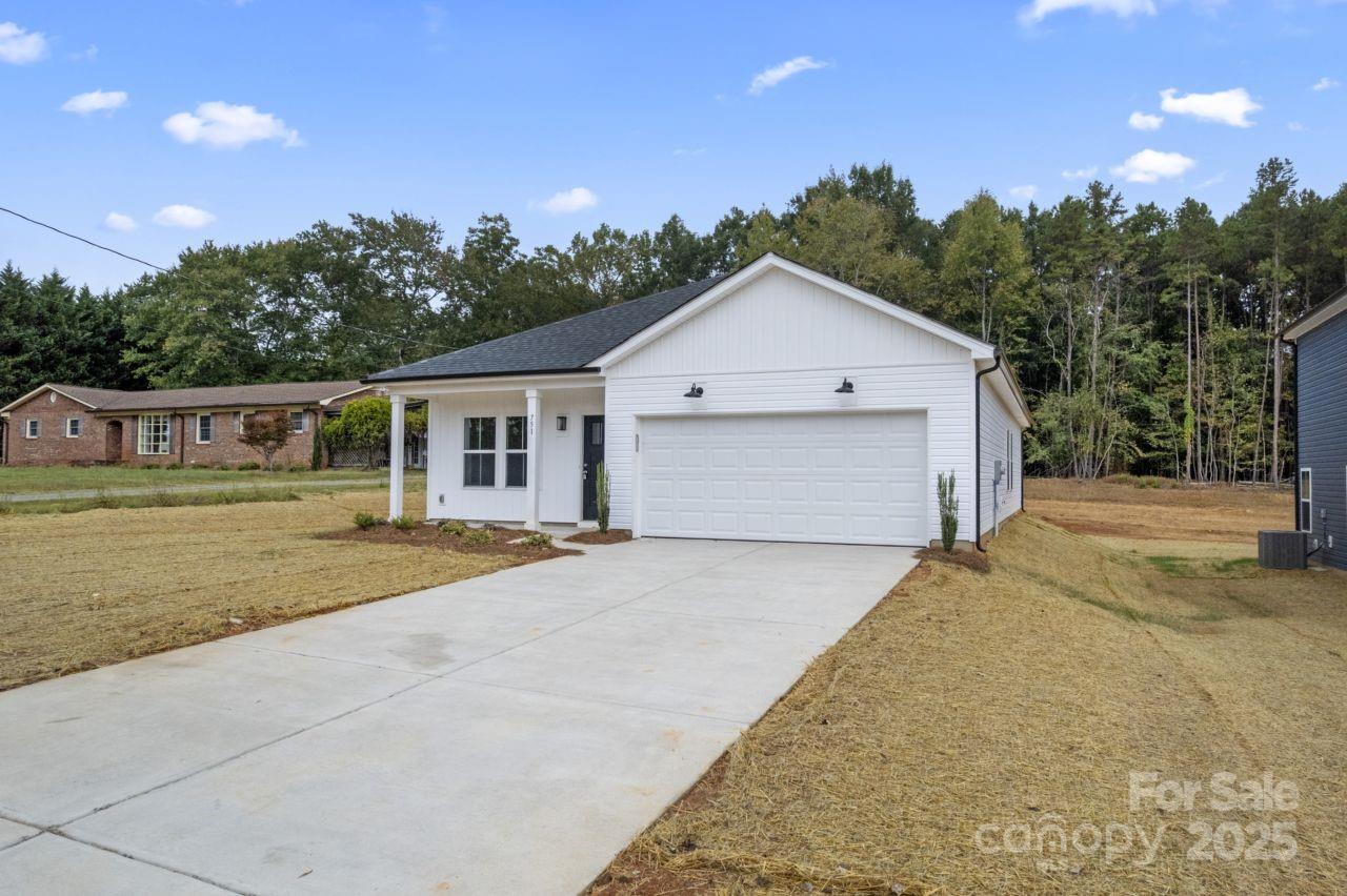 751 Mockingbird Road, Unit 1 Albemarle, NC 28001 - Photo 4 of 29 front view of a house with a yard
