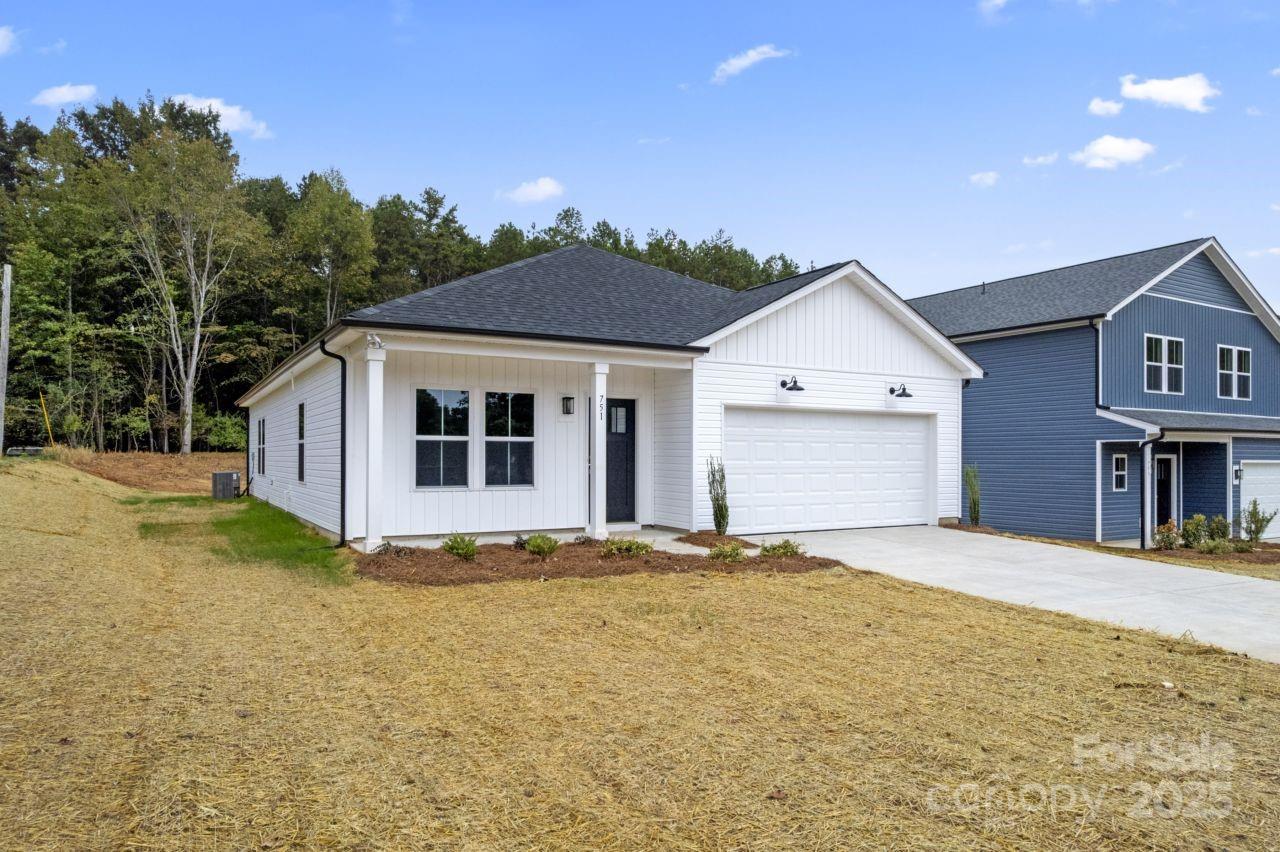 751 Mockingbird Road, Unit 1 Albemarle, NC 28001 - Photo 5 of 29 a front view of a house with a yard