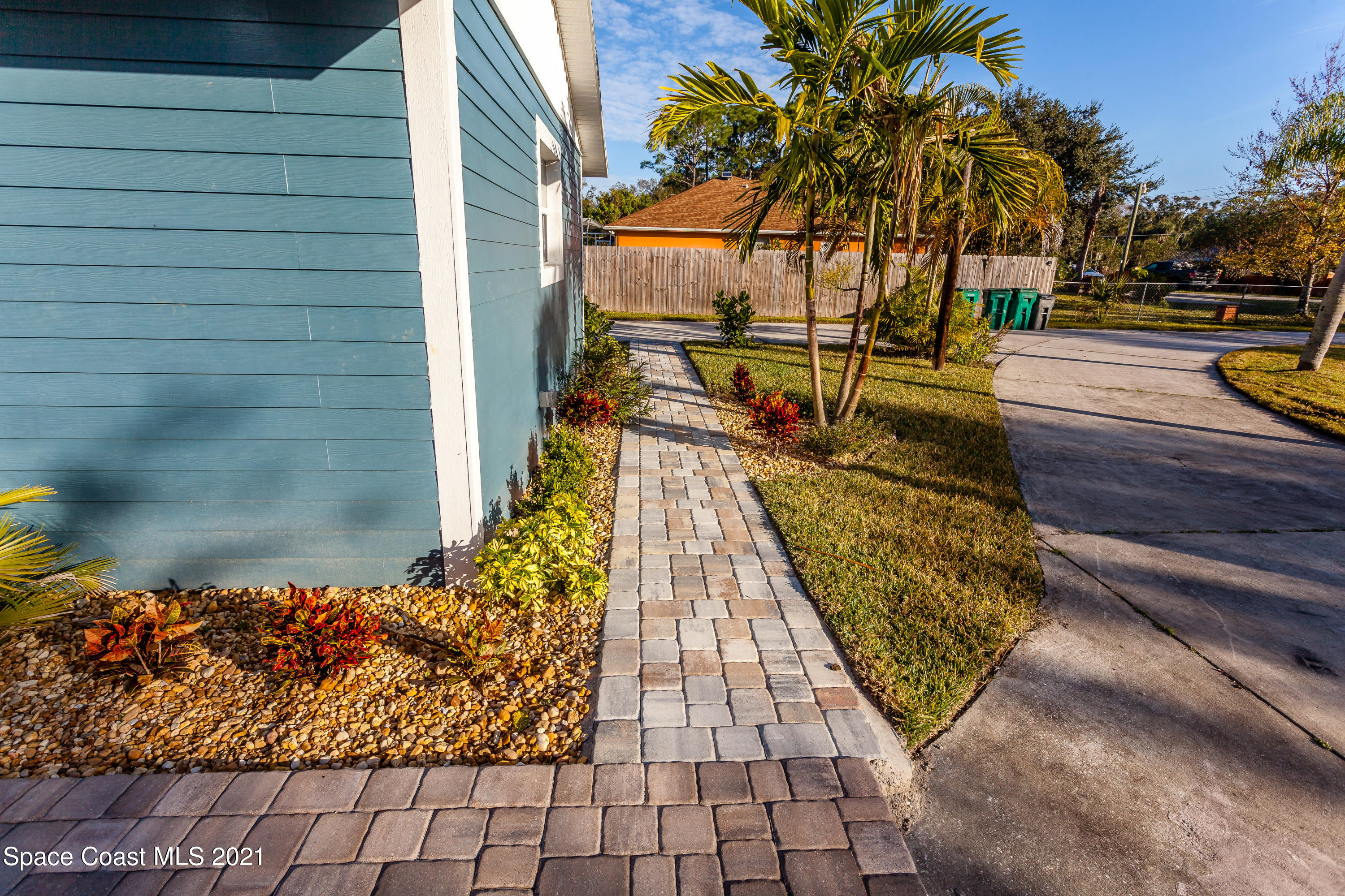 3400 Harlock Road Melbourne, FL 32934 - Photo 8 of 28 a view of a balcony with wooden floor and fence