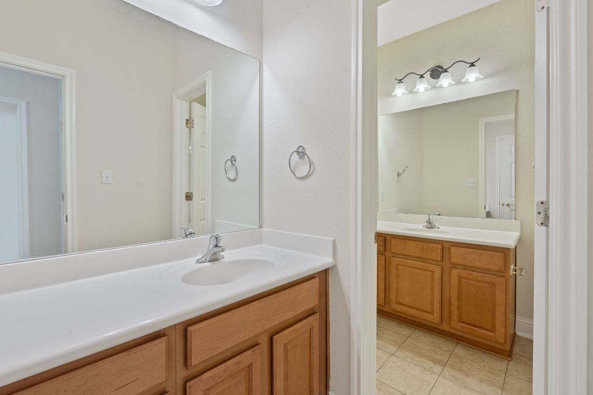 738 Nelson Ranch Road Cedar Park, TX 78613 - Photo 28 of 35 Bathroom with a sink, tile patterned flooring, and two vanities