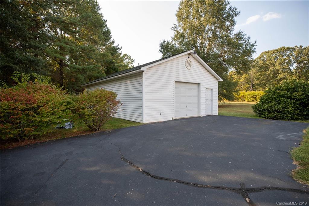 453 State Rd S-46-422 Clover, SC 29710 - Photo 5 of 20 a view of a house with a yard and garage