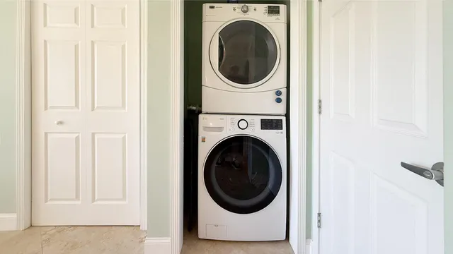 a view of a house with a tree in front