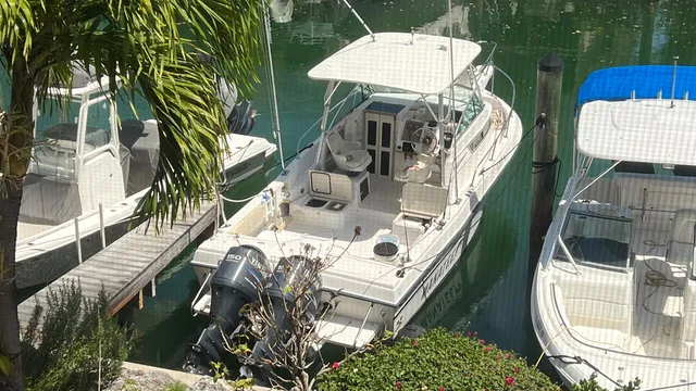 a front view of a house with lake view and a floor to ceiling window
