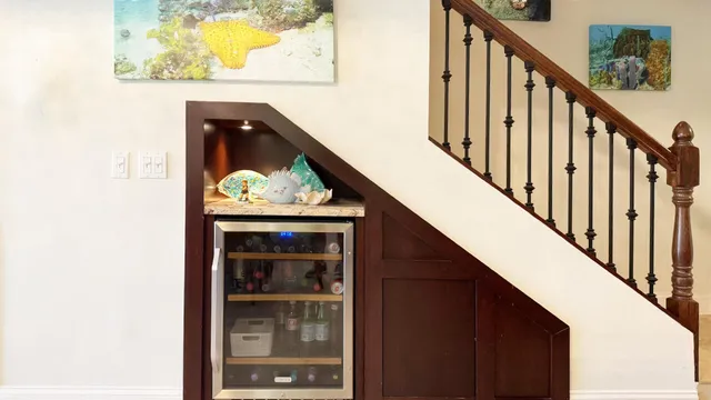 a vase of flowers sitting on a table in front of a door